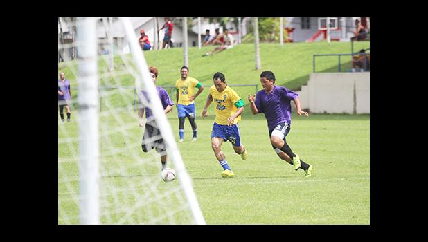 Tuaoloina ‘Stein’ Solofa (left) of the Tafuna Jets in an attacking run against Faiai Ioapo of PanSa during a men’s game on Match Day 4 of the 2016 FFAS National League on Saturday, Sept. 10, at Pago Park Soccer Stadium.   [FFAS MEDIA/Brian Vitolio]