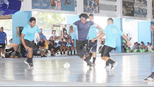 Peter Alosio of the Tafuna Jets 1 (middle) dribbles against several Green Bay B opponents during their 2017 Futsal Tournament’s pool game at Samoana High School’s gymnasium on Saturday, May 6, 2017.  [FFAS MEDIA/Brian Vitolio]