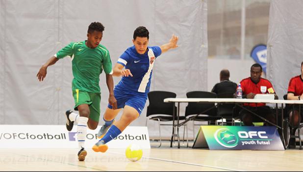 Joseph ‘Junior’ Choi of American Samoa and a Solomon Islands opponent in action during a game of the OFC Youth Futsal Tournament at Bruce Pulman Arena in Auckland, New Zealand on Wednesday, October 4, 2017.  [FFAS MEDIA/Brian Vitolio]