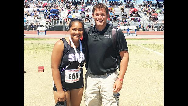 Fifteen-year-old rising Samoan track and field star Kau'ilani Malauulu Misipeka with coach Andrew Papas. Kau'ilani is making noise in Sin City, taking top honors in shot put and discuss throwing. See story for full details.  [photo: courtesy]