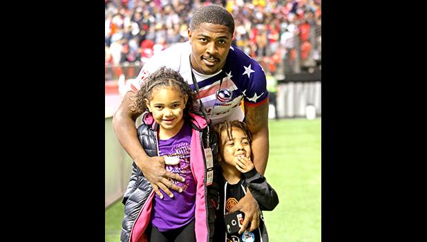 USA Eagles 7s player, Kevon Williams, enjoys hosting his kids on the pitch at BC Place, after the Canada 7s, Vancouver, Canada. [photo: Barry Markowitz USA Eagles 7s player, Kevon Williams, enjoys hosting his kids on the pitch at BC Place, after the Canada 7s, Vancouver, Canada. [photo: Barry Markowitz