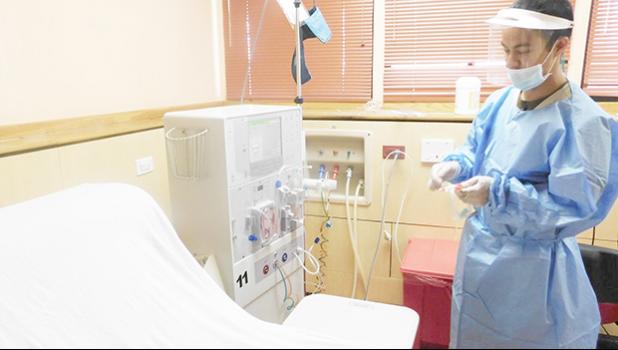 Nurse Marvin prepares the dialysis machine for a patient at the Dialysis clinic. Obesity & diabetes is the most prevalent of non-communicable diseases in the Territory and LBJ is asking patients to be pro-active — keep your appointments and live healthy.  [photo: Ese Malala]