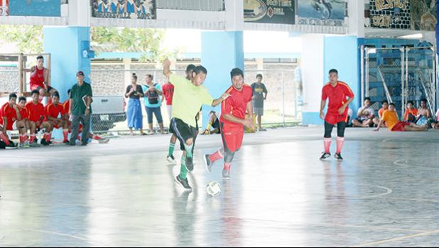 A Lion Heart A player dribbles away from a Black Roses opponent during their 2017 Futsal Tournament’s pool game at Samoana High School’s gymnasium on Saturday, May 6, 2017.  [FFAS MEDIA/Brian Vitolio]