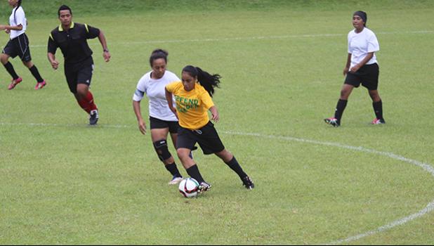 Oloataua Tofaeono of the Leone Lions dribbles the ball while being defended by the Fa’asao-Marist Cougars’ Jordynn Liu-Kuey during an ASHSAA varsity girls’ soccer game on Saturday, Feb. 24, 2018 at Pago Park Soccer Stadium.  [FFAS MEDIA/Brian Vitolio]