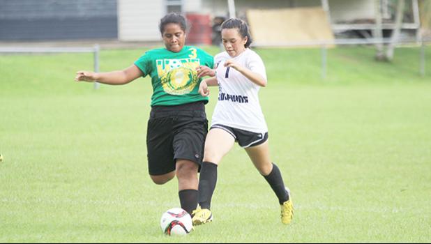  Michelle Wisneske (#7) of South Pacific Academy, and Leone Lions’ Frances Nautu (#3) battle for possession of the ball during an ASHSAA Girls varsity soccer game on Monday, Feb. 6, 2017 at Pago Park Soccer Stadium.   [FFAS MEDIA/Brian Vitolio]