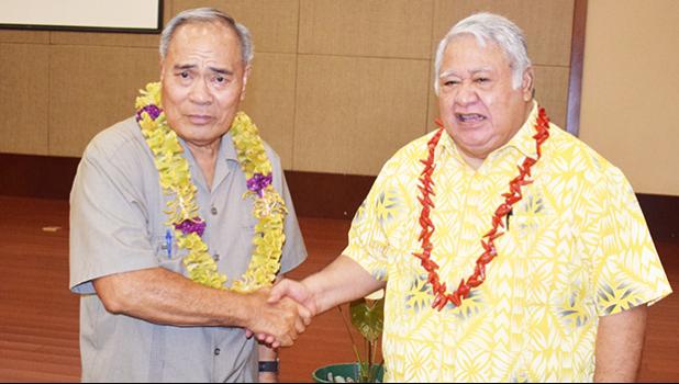 This photo by Apia-based journalist Joyetter Feagaimaali’i, provided to Samoa News for publication with permission, shows American Samoa Gov. Lolo Matalasi Moliga (left) shaking hands with Samoa Prime Minister Tuilaepa Sailele Malielegaoi, before the start of the Nov. 30th executive session of the Two Samoa Talks at the Tui Atua Tupua Tamasese Efi Convention Center in the heart of Apia.  [photo: Joyetter Feagaimaali’i]