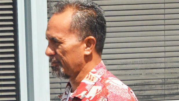 Former Customs Office supervisor, Sefulu Maifea making his way to the TCF van after he was sentenced by the court to serve 28 months in jail for stealing over $11,000 from the American Samoa Government. [photo: AF]