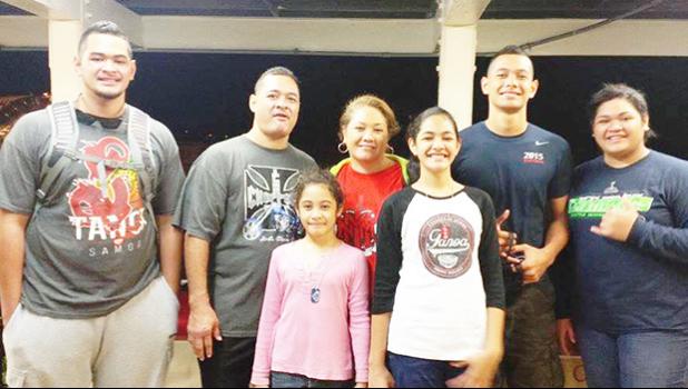 Samoana HS wide receiver Ralph Manuma Taufaasau (second from right) with his parents Jane and Wally, brother Edward, and sisters Genesis, Esther, and Megan. Ralph is the next hot thing in college football recruiting, with coaches from UH and WSU expressing strong interest in the Pago Pago native.  [Courtesy photo]
