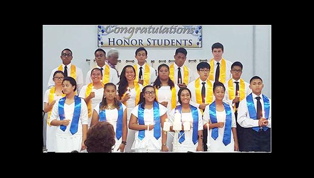 Meet the 17 newest members of the NHS and NJHS of Manumalo Academy who were inducted last Friday during a special ceremony held in the school chapel.  [Photo: Blue Chen-Fruean]