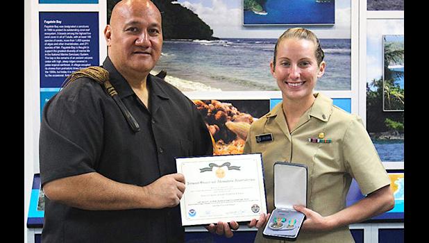 Pictured is LTjg Jarlenski with acting NMSAS superintendent Atuatasi Peau.  [photo: BC]