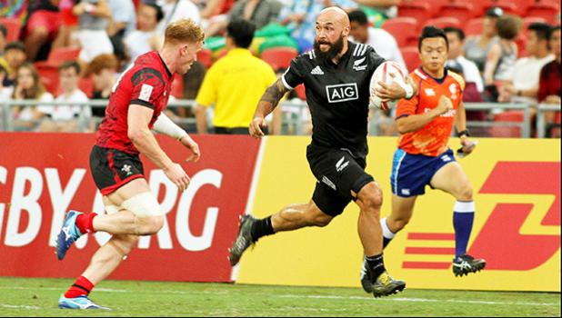 Captain DJ Forbes advances the ball in the All Blacks' 36-14 victory over Wales at the Singapore Sevens, Day 1, National Stadium, Singapore. [Photo: Barry Markowitz]