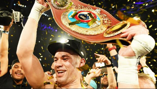 Joseph Parker holds up the WBO heavyweight title belt following his victory in Auckland last year. [Stuff NZ]