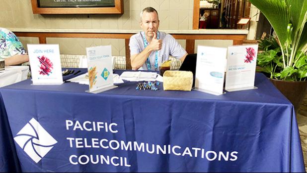 Tim Bailey of Speedcast, Wan Chai, Hong Kong, China manned the Pacific Telecommunications Council booth, at the Hilton Hawaiian Village, Honolulu, Hawaii to help promote cooperation amongst technology firms.    [photo: Barry Markowitz]