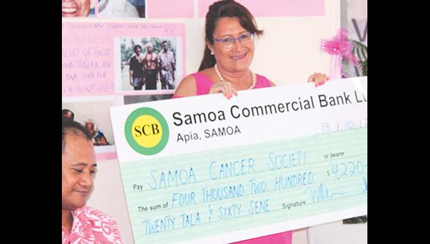 Samoa Housing Corporation Chief Executive Mata’utia Rula Levi presenting their donation to the Samoa Cancer Society to assist with the early detection to cure cancer public awareness campaign.  [Courtesy photo]