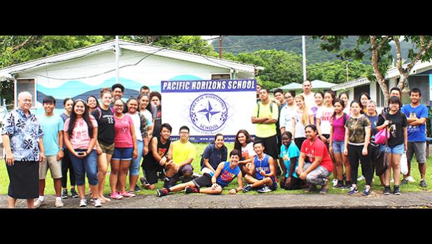ASG Office of Political Status, Constitutional Review and Federal Relations executive director Tapaau Dr. Daniel Aga (far left) with students and teachers of Pacific Horizons School on Tuesday, as part of the office’s 2018 outreach, which starts with the private schools. See story inside for details. [courtesy photo]