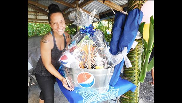 Sales Manager Christa Satele of Pago Pago Trading Company who donated a prize in celebration of the one year anniversary for the Pacific Tires & Auto Parts last Saturday in Tafuna. [Photo: Ese Malala]