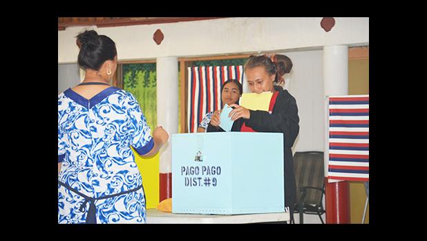 A voter puts a ballot into the ballot box at the Pago Pago village polling station on Election Day. [photo: AF]