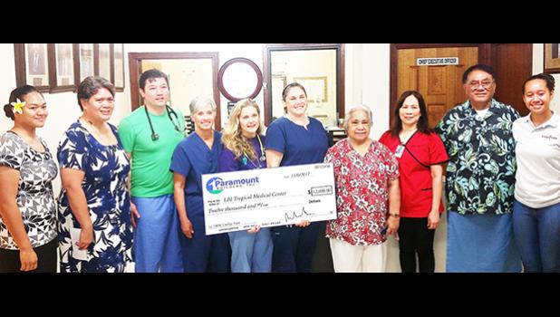 As has been the norm in past years, Paramount Builders donated $12,000 yesterday to the LBJ Medical Center, to help with costs associated with having a team of cardiologists and specialists from the Oregon Health and Science University in the territory this week to treat local youngsters with possible cases of rheumatic fever and those already diagnosed with rheumatic heart disease. Mrs. Wanda Alofa, wife of Paramount Builders owner/ CEO, presented the check to LBJ Chief Executive Officer Faumuina Taufetee 