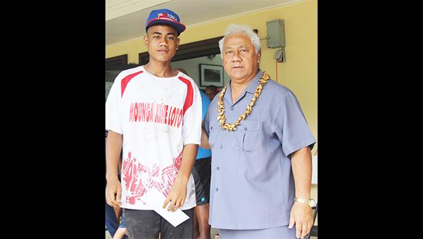 Pauli Afu, left, of Vaiala Tongan’s 13-15 boys receives his MVP award for the 2017 FFAS Summer Youth League from Sen. Faiivae Iuli Alex Godinet on July 15 at Pago Park Soccer Stadium. [FFAS MEDIA/Brian Vitolio] 
