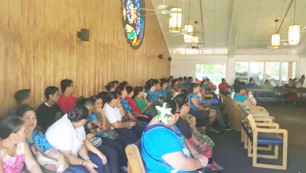 Families, friends and co-workers of Saito Paulo at the chapel attending a prayer service for Paulo — he died yesterday morning. Paulo had been in a coma since he was involved in the electrocution incident while working for the Manu’a’s store, located in the Tafuna industrial park, on Saturday morning. He is the second person to have died from the incident.  [Photo: JL]
