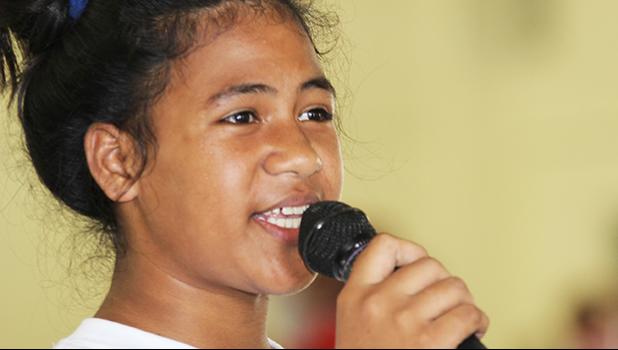 A Pava’ia’i elementary student presenter explains her schools theme and session to the judges during the ASDOE/FFAS Just Play Program finale on Thursday, April 27, 2017 at the DYWA gymnasium in Pago Pago.   [FFAS MEDIA/Brian Vitolio]