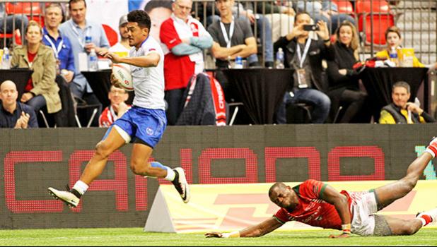 Joe Perez skips away from a Kenyan, scoring a second half try in Samoa's 26-7 trouncing of Kenya at Canada Sevens, Day 2, BC Place, Vancouver, Canada in March of this year.   [Photo by Barry Markowitz, 3/12/17]