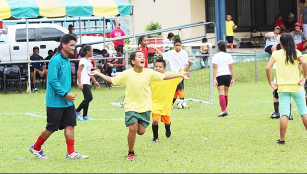  A Pago Youth player of the 7-9 mixed age group celebrates after his team scores a goal on July 4, 2017 during opening day of the FFAS Summer Youth League at Pago Park Soccer Stadium.  [FFAS MEDIA/Brian Vitolio]