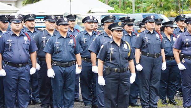 Police officers stand at attention, at the start of the official opening yesterday morning at the Fagatogo malae — Malae o le Talu — of Police Week in American Samoa. Last week US President Donald J. Trump issued a proclamation which proclaims May 15th as Peace Officers Day, honoring those who died in the line of duty last year. [photo: AF]
