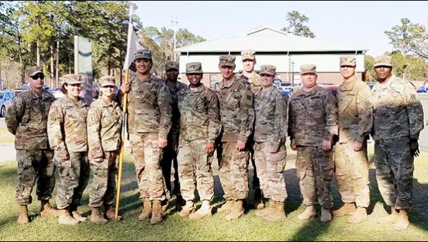 The leadership and command team of the Headquarters Company (HHC) of the 87th CSSB, of the 3rd Sustainment Brigade, Fort Stewart, Georgia (L-R): SSG POSER, J. SFC SORIANO, M. CPT NORTHRUP, R (Company Commander) SPC AUVA'A, A, SSG BAILEY J, SGT JONES M. SFC SOUTHWORTH T 1LT LOVINGGOOD J. 1LT PASCETTA N (COMPANY EXECUTIVE OFFICER) SPC MCGRAW B.  SPC MENDIOLA G. AND 1SG SMITH, as they congratulate SPC Auva'a on achieving her “gender marker” change.  SPC Auva'a is the First Samoan Transgender to serve openly as