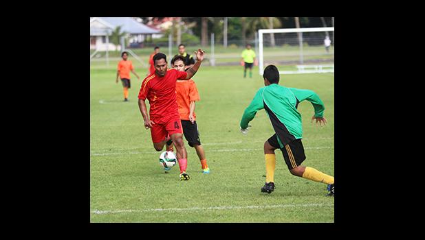  Iosia Tasi of Black Roses defends against a Royal Puma attacker to give his goalie time to collect the ball during a men’s game on Match Day 4 of the 2016 FFAS National League on Saturday, Sept. 10, at Pago Park Soccer Stadium.   [FFAS MEDIA/Brian Vitolio]