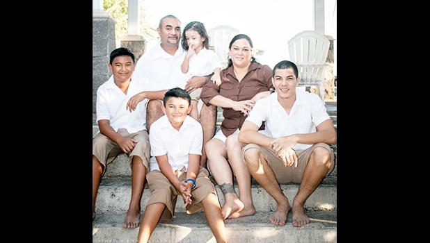 US Navy Yeoman Seaman Recruit Faafetaiilealii “Tai” Raison (far right) with his three brothers and parents Josephine and Melvin Ae. Tai was recently recognized as PCU Portland LPD 27s Sailor of the Week. See story for full details.  [photo: courtesy]
