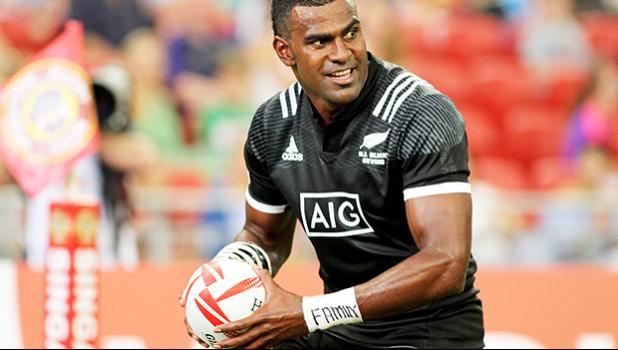 NZ Joe Ravouvou plays with a Wales defender as he scores a try in the All Blacks 36-14 victory over Wales at the Singapore Sevens, Day 1, National Stadium, Singapore.  [Photo: Barry Markowitz]