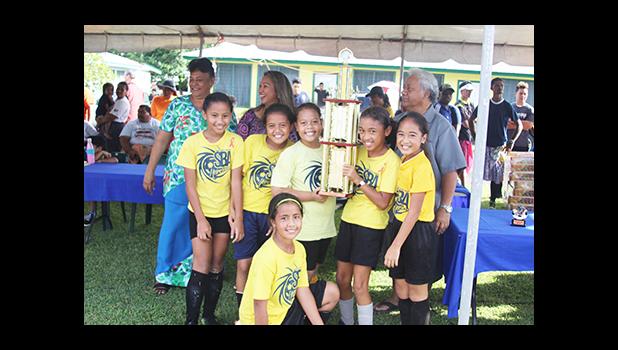 Samoa Baptist Academy’s championship winning team for the 2016 FFAS Private Elementary Schools Soccer League’s Girls 3-5 Division with their trophy on Tuesday, Nov. 22, 2016.  [FFAS MEDIA/Brian Vitolio]