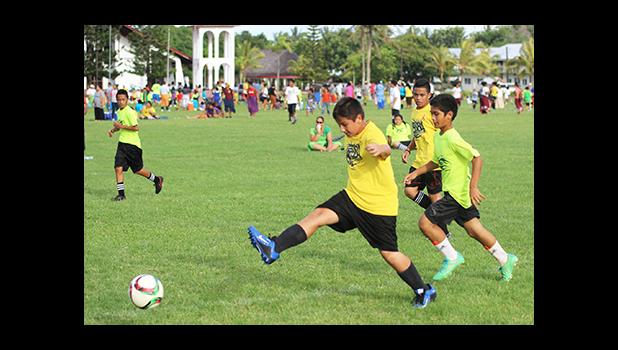 A Samoa Baptist Academy player clears the ball during a Boys Grades 6-8 Division game against Marist St. Francis in a Boy’s Grades’ 6-8 Division game against Peteli Academy for the 2016 FFAS Private Elementary Schools Soccer League on Wednesday, Nov. 9, 2016 at the Kanana Fou Seminary field in Tafuna.  [FFAS MEDIA/Brian Vitolio]
