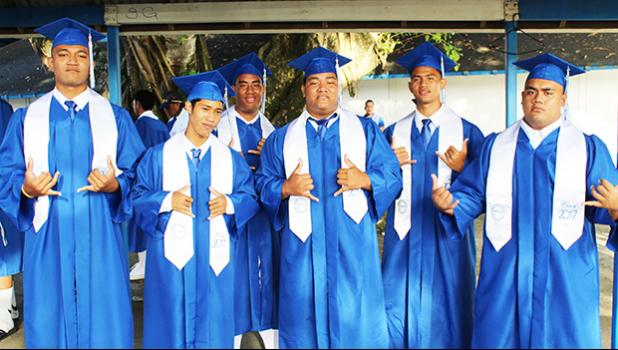 Proud Samoana graduates pose for  the Samoa News camera before heading into their graduation ceremony to receive their high school diplomas. Congratulations graduates! [Photo:EM]