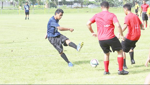 SPA’s Harvey Manu takes a shot at goal while two Faga’itua defenders attempt to block his shot during an ASHSAA Boys soccer game on Saturday, March 25, 2017 at Pago Park Soccer Stadium.  [FFAS MEDIA/Brian Vitolio]