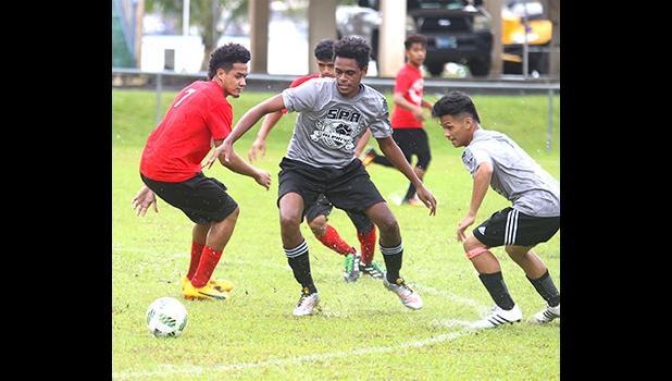 SPA Dolphins’ players in action against the Faga’itua Vikings during an ASHSAA Boys varsity Soccer game on Tuesday, April 3, 2018 at Pago Park Soccer Stadium.  [FFAS MEDIA/Brian Vitolio]
