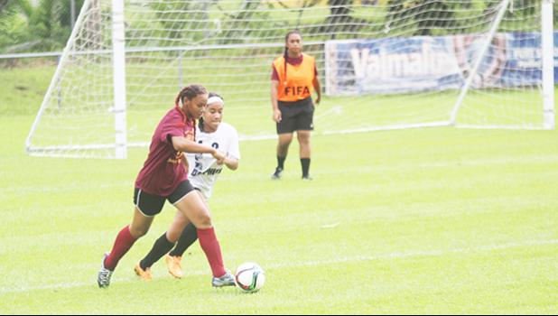 Tafuna’s Mala Mataiao dribbles away from SPA opponent Jessica Satele during an ASHSAA Girls varsity soccer game on Monday, Feb. 1, 2017 at Pago Park Soccer Stadium.   [FFAS MEDIA/Brian Vitolio]