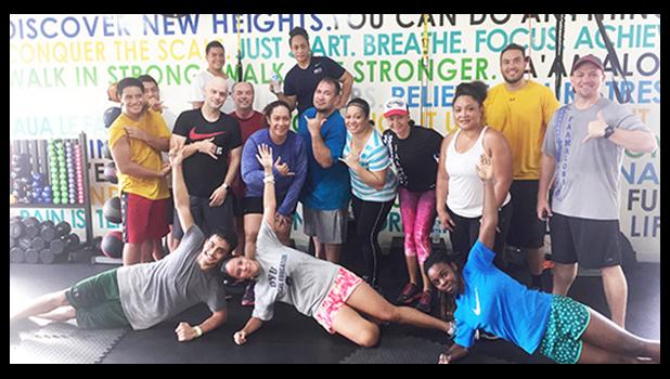 Locals and visitors at the South Pacific Watersports & Fitness after the 6am workout posing for a quick picture and getting ready to do the 7am workout. [Photo: Ese Malala]