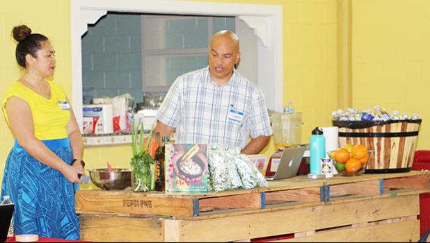 Master Chef Kenneth Kuala and his beautiful assistant and wife, Luisa, demonstrate for members of the Facebook weight-loss group SSY-Slimmer Stronger You, how to cook and make sauces and salad dressings using healthy, locally grown ingredients. The demonstration was part of the first ever SSY Meet & Greet event that took place December 8 at the VA Center in Tafuna.