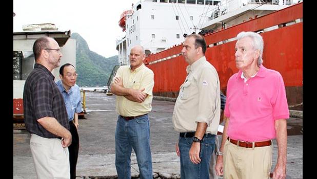 In this Nov. 2010 Samoa News file photo, Tri Marine Managing Director, Joe Hanby, Luen Thai President & COO, Sam H.T. Chou, STP Chief Executive, Ian Boatwood, STP Facility Manager, Craig Double, and Luen Thai Special Projects Executive, Joe Murphy, discuss the rehabilitation of the old SamPac Chicken of the Sea Cannery now Samoa Tuna Processors, on the busy STP dock. Now STP will close indecently in Dec.  Read  story on left. [Photo: Barry Markowitz]  