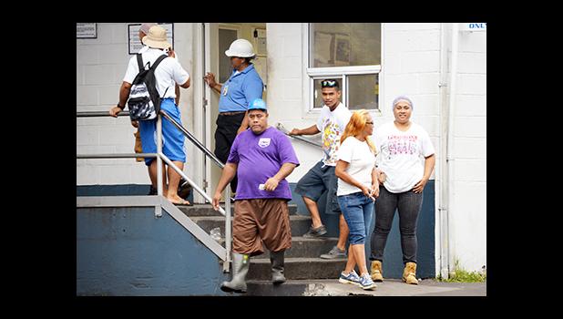 A look at some of Samoa Tuna Processors employees in front of the STP gate on Oct. 13, the same day its owner Tri Marine International announced the indefinite closure of STP effective Dec. 11. Rumors of Tri Marine selling its facility or at least parts of its facility are rampant, while the company has said STP will be maintained as a hub of its Pacific operations, while a final solution is sought. [photo: AF]