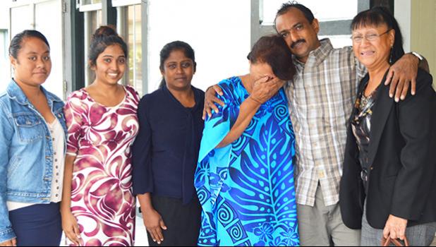 Salend Singh (second from right) with his family including his wife and daughter outside of High Court after the jury found him not guilty to all four charges against him. [photo by AF]