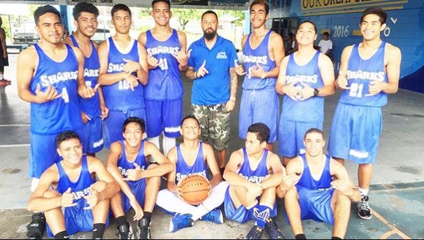Samoana Sharks Back-to-Back Champions for the Junior Varsity Basketball Division. Head Coach Ames with his JV boys after winning the title for second-straight year against the Marist Crusaders on Saturday morning at the Samoana High School Gymnasium in Utulei.  [photo: Ese Malala]