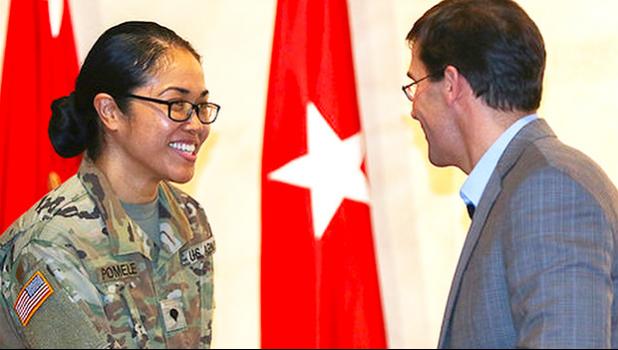 SPC Naomi Sautia-Pomele, of the 548th Combat Sustainment Support Battalion, was recognized at a Fort Drum town hall meeting with Secretary of the Army Dr. Mark T. Esper during his visit on March 29, 2018.  Sautia-Pomele was one of five female soldiers to be nationally recognized during Women's History Month for exceptional service to the US Army.  [photo credit: SGT Liane Hatch]