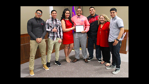 Family and Friends of Ricardo Gonzales (left to right) Tanielu Matautia, Salvation Lee, Caroline EJT Schuster, Justin Asaeli, Omeka Siataga, Loha Schuster, with , Ricardo Gonzales (center), after he received the Top Scholar Award in Criminal Justice from Missouri Valley College, last week. [courtesy photo]