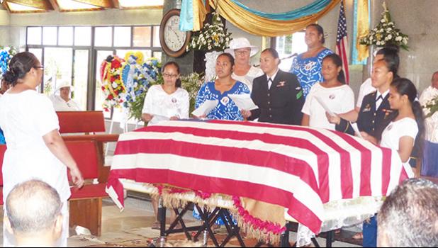 The United States flag draped casket of the late former Sen. Fuata Dr. Tagiilima I’atala, during his memorial service on Sunday at the CCCAS church in Amouli, with his children and his wife, Manumanu Sipili I’atala  (in white and wearing a hat — far left). [photo: Samoa News]