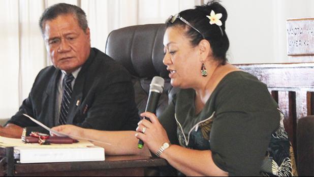 Senate President ProTem, Nuanuaolefeagaiga Saoluaga Nua (left) lookong on, as Senate legal counsel Mitzie Jessop-Ta’ase reads for senators, local law which requires Fono approval of money in the law enforcement fund to finance purchases of new police vehicles. [photo: FS]