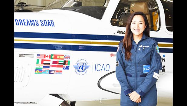 This 2017 photo provided by the non-profit group Dreams Soar, shows female aviator, Shaesta Waiz, with her Dreams Soar single engine Beechcraft Bonanza A36 plane. Waiz began her global solo flight in May this year from Dayton, Florida. She landed at Pago Pago International Airport last Friday afternoon for a two-day stop over to refuel and rest before departing yesterday. On the plane’s body are flags of some of the countries and territories where she made  stops, including the American Samoa Flag — shown o