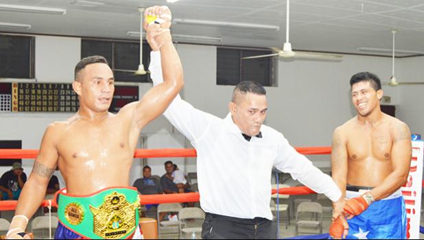 Sui Palauni of American Samoa (left) won the vacant light heavy weight All Samoan Championship Title against Michael Fonoti of Samoa by technical decision during the Flag Day 2017 Championship that was for the Governor’s Cup and championship title last Saturday night at the old Bowling Alley in Tafuna. [photo: AF]